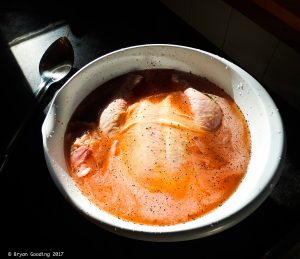 Photo of chicken soaking in brine.