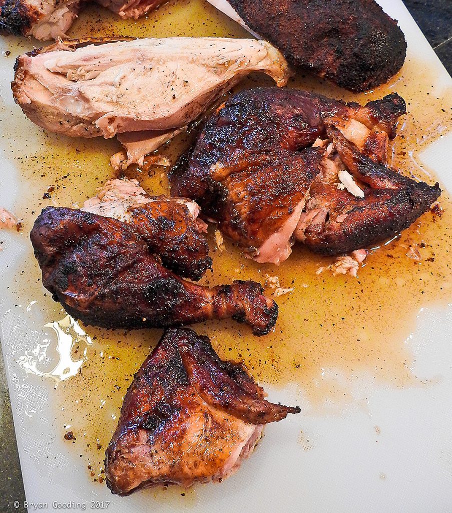 Photo of finished smoked chicken on cutting board